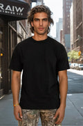 Men wearing Ironside The Heavy One 1601 tactical jacket by SpectraUSA in reactive black, showing front view with multiple pockets.