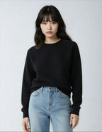 Black fleece crew neck sweatshirt for women by SpectraUSA, featuring a comfortable, casual fit with ribbed cuffs and neckline.