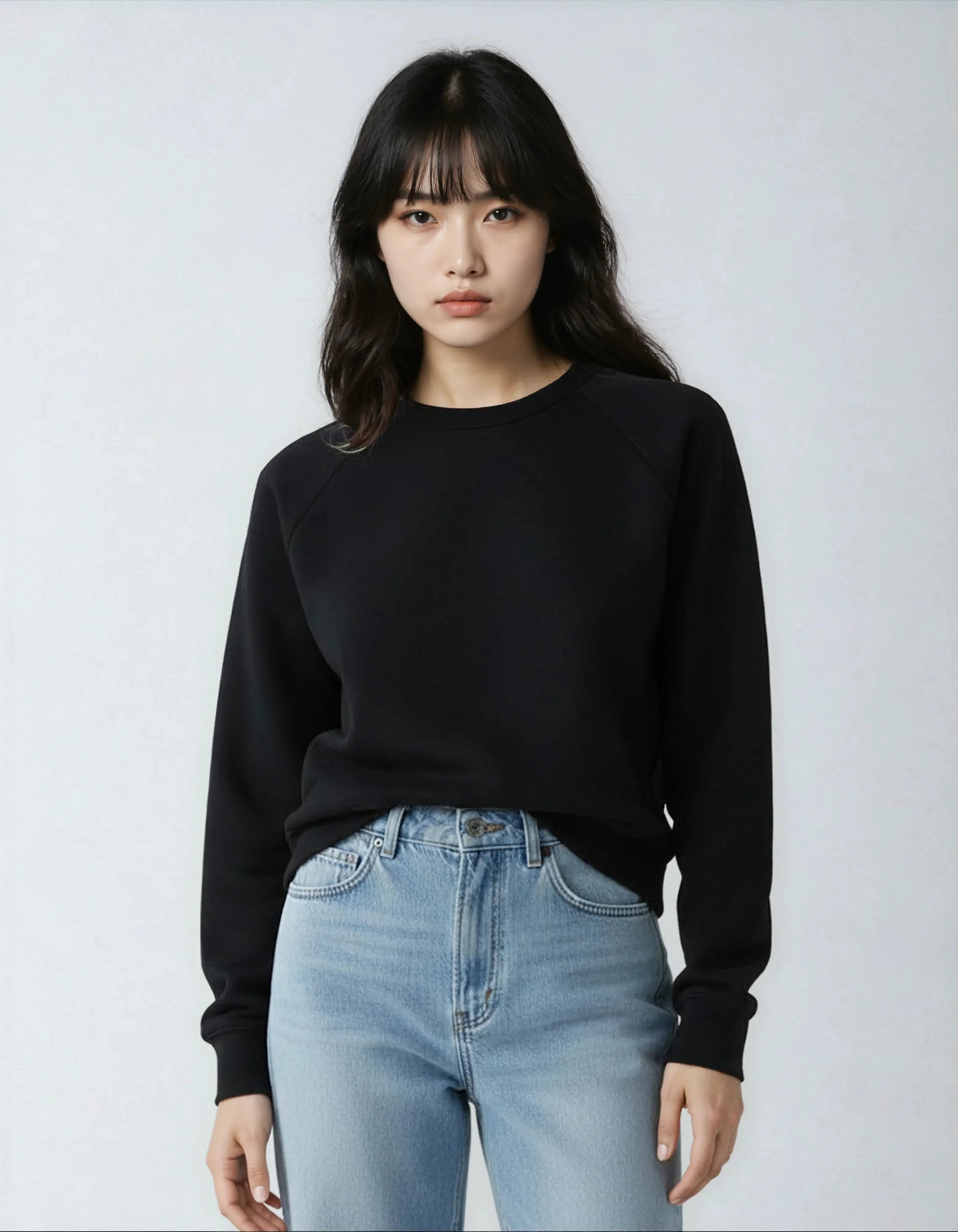 Black fleece crew neck sweatshirt for women by SpectraUSA, featuring a comfortable, casual fit with ribbed cuffs and neckline.