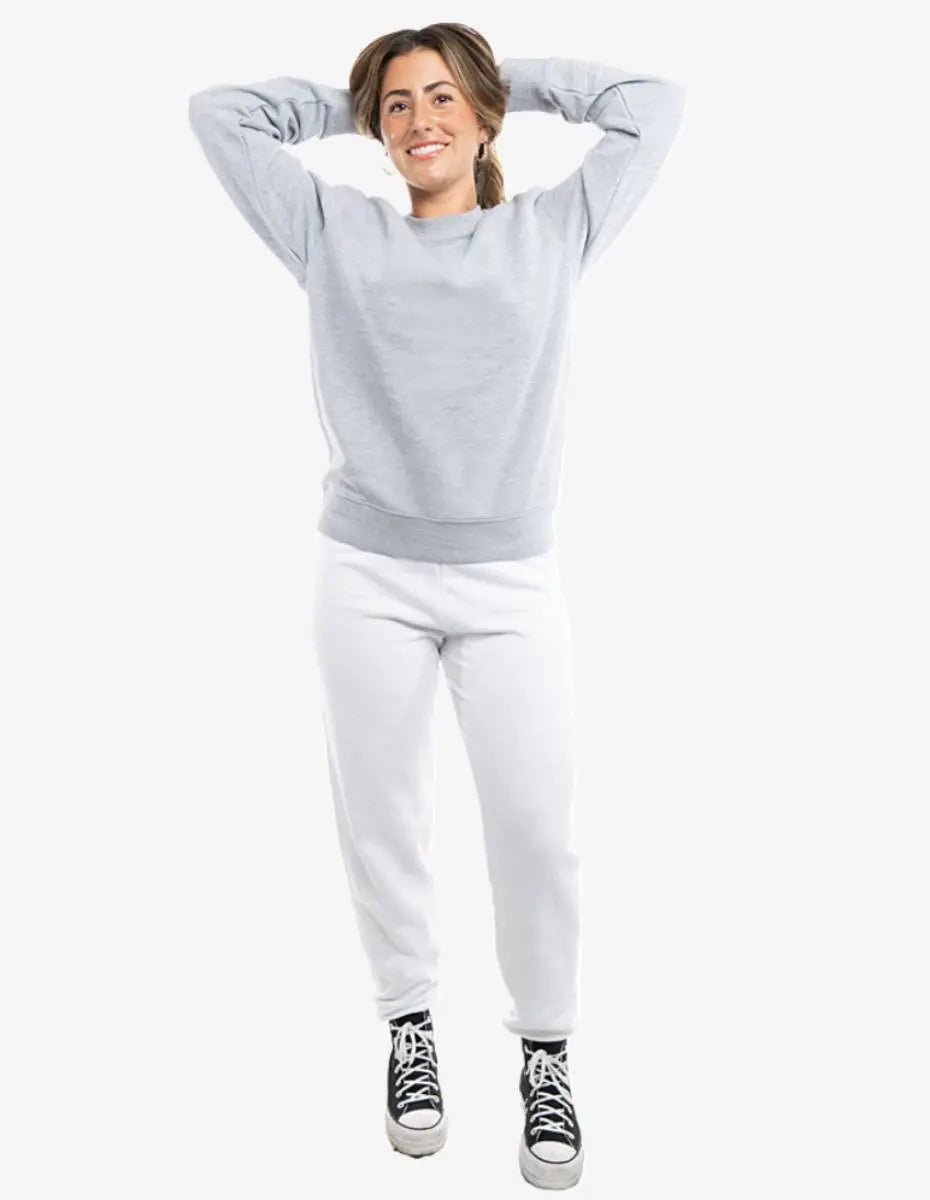 White fleece jogger pants from SpectraUSA, style P2005, shown on a model with an elastic waistband and relaxed fit.
