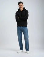 Black heavyweight fleece hoodie by SpectraUSA, full-body view showcasing the cozy, durable design.