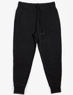Unisex black fleece sweatpants by SpectraUSA, shown on a model, with a relaxed fit and elastic waistband for casual comfort.