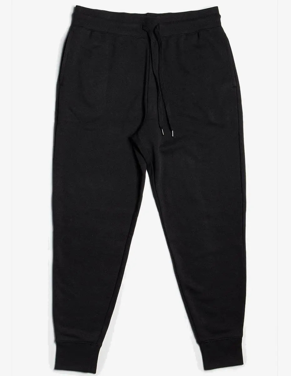 Unisex black fleece sweatpants by SpectraUSA, shown on a model, with a relaxed fit and elastic waistband for casual comfort.