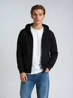 Black unisex zip hoodie from SpectraUSA, midweight fleece with full front zipper and hood, casual and comfortable for everyday wear.