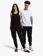 Black men's fleece jogger sweatpants by SpectraUSA, midweight unisex design, shown in a studio setting.
