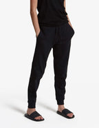 Unisex black fleece sweatpants by SpectraUSA, midweight joggers with a comfortable fit and casual style, shown in studio image.