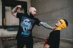 Arrival T-Shirt Any Means Necessary Clothing