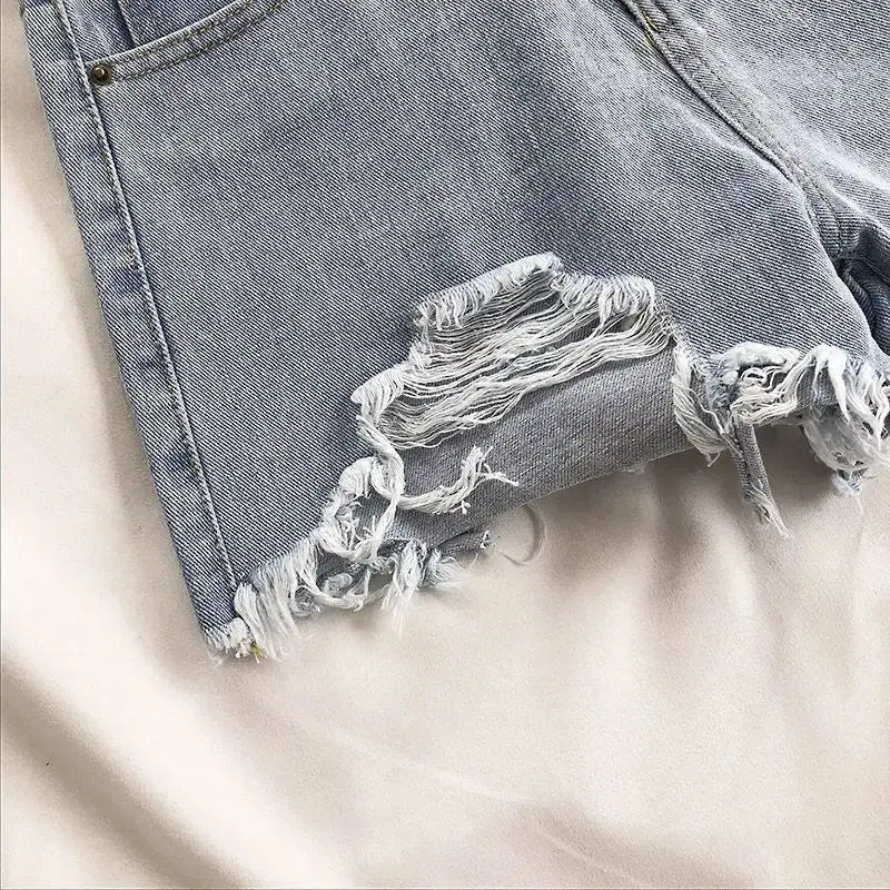 Pocket Tassel Perforated Denim Shorts Female - Blade & Thread