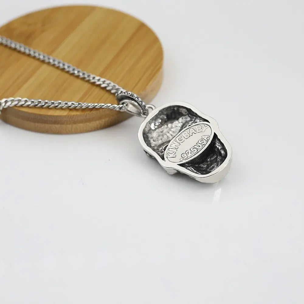Retro Baroque garnet eye skull pendant - Blade & Thread