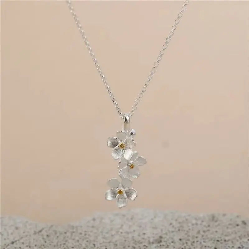 triangle forget me not necklace nowadaysfashion